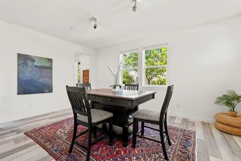 a bedroom with a bed and a table