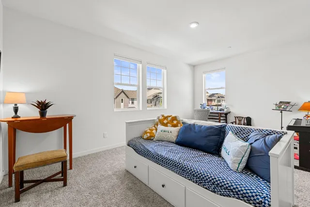 a bedroom with a bed and window