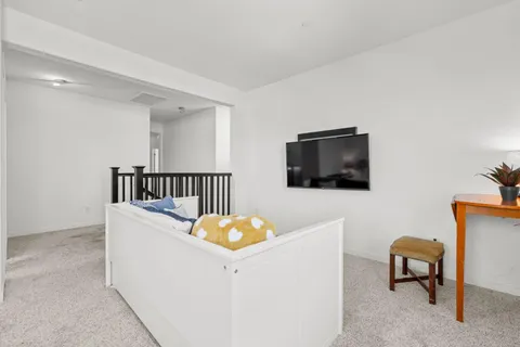 a bedroom with a bed and window