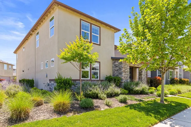 a kitchen with stainless steel appliances a stove a sink and a microwave