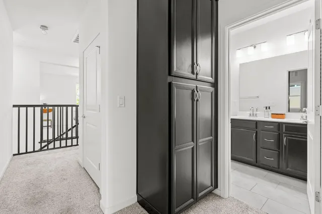 a spacious bathroom with a tub sink shower and mirror
