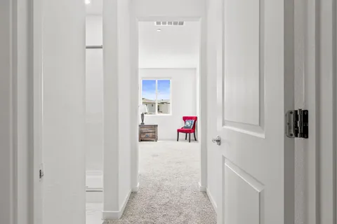 a bedroom with a bed and a ceiling fan
