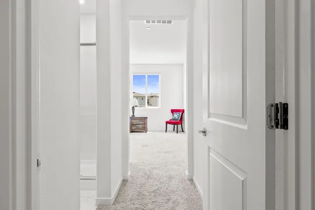 a bedroom with a bed and a ceiling fan