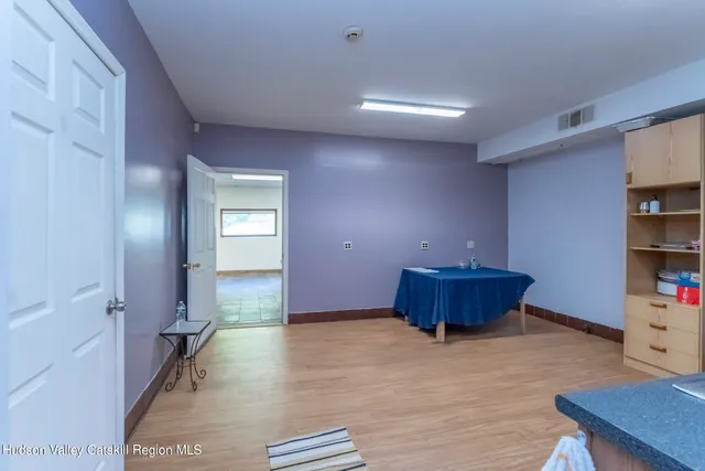 a living room with furniture and book shelf