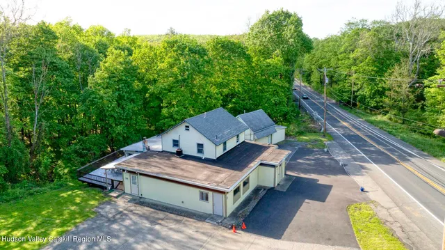 a wooden bench sitting in the middle of a forest
