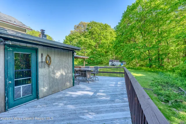 a view of a patio with a table and chairs