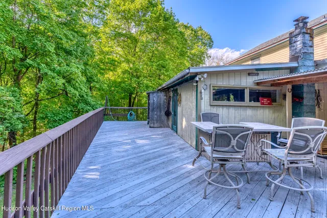 a backyard of a house with lots of green space and garden