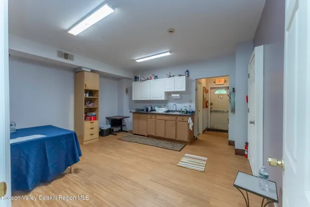 a kitchen with stainless steel appliances granite countertop a refrigerator sink and cabinets