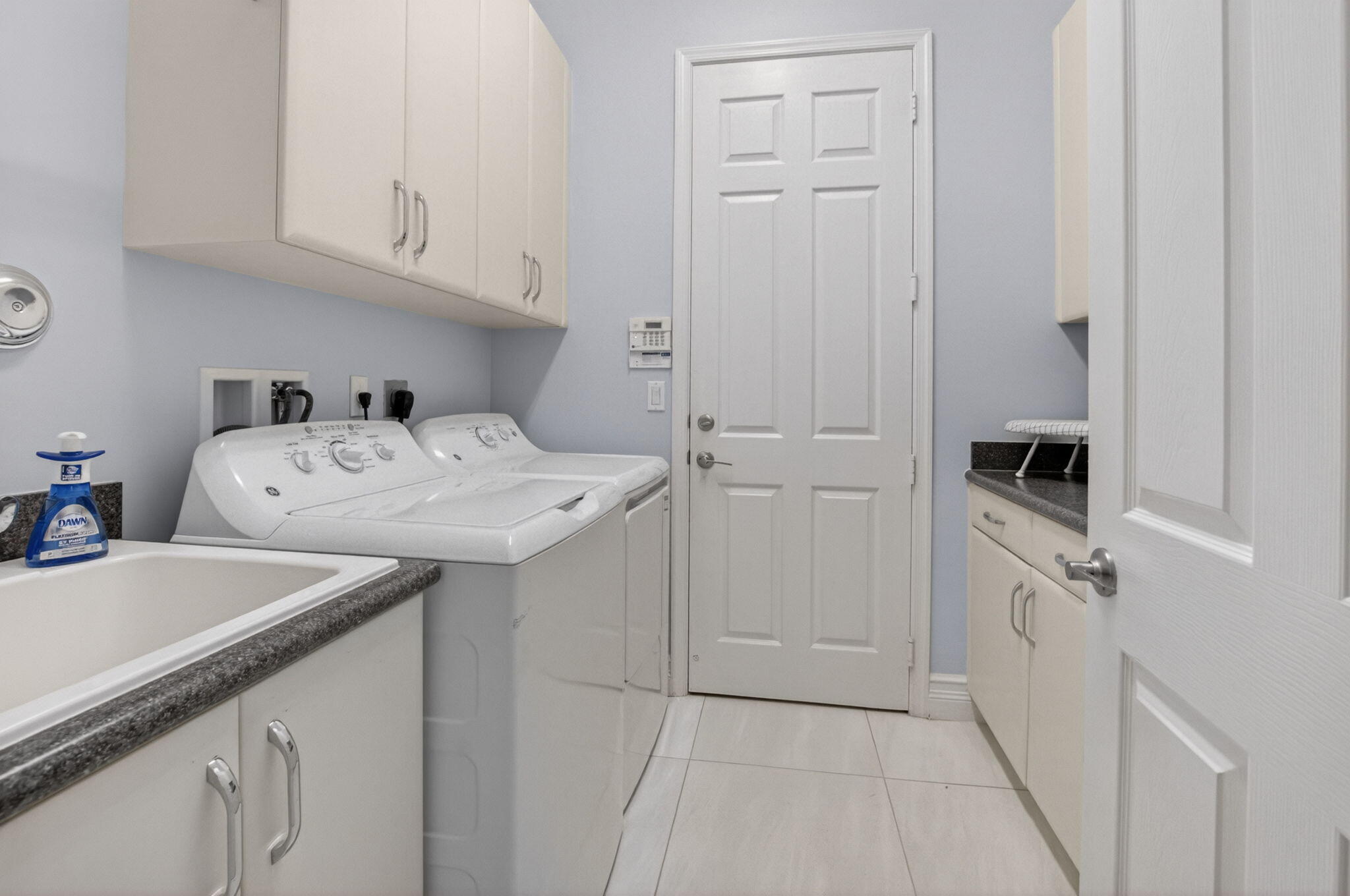 8263 Arabian Range Road Boynton Beach, FL 33473 - Photo 46 of 52 a utility room with cabinets