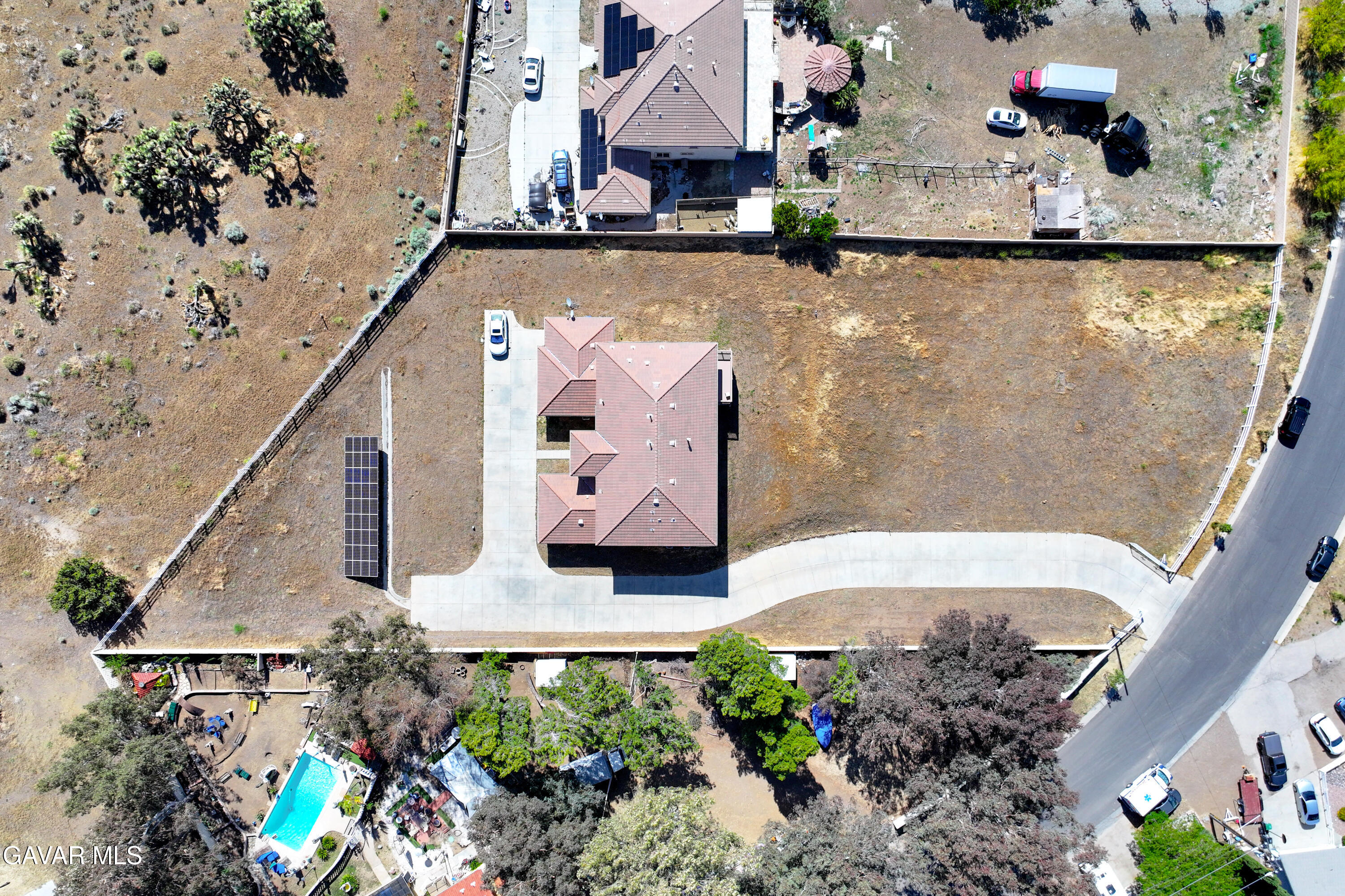 658 Lago Lindo Road Palmdale, CA 93550 - Photo 83 of 91 an aerial view of a house with a swimming pool