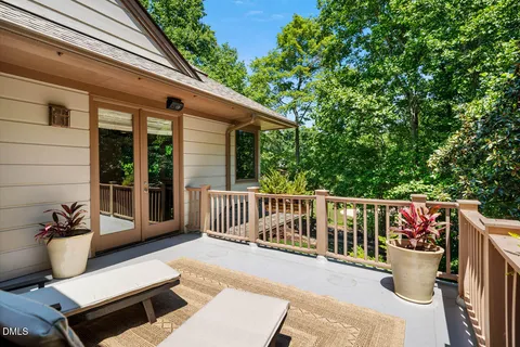 a view of a backyard with sitting area and garden