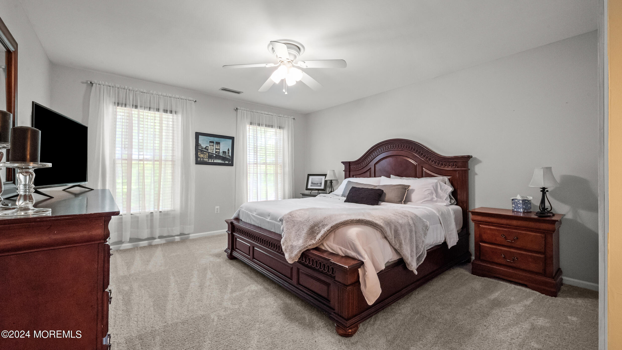 55 Tower Road Cream Ridge, NJ 08514 - Photo 29 of 47 a spacious bedroom with a bed and a flat screen tv