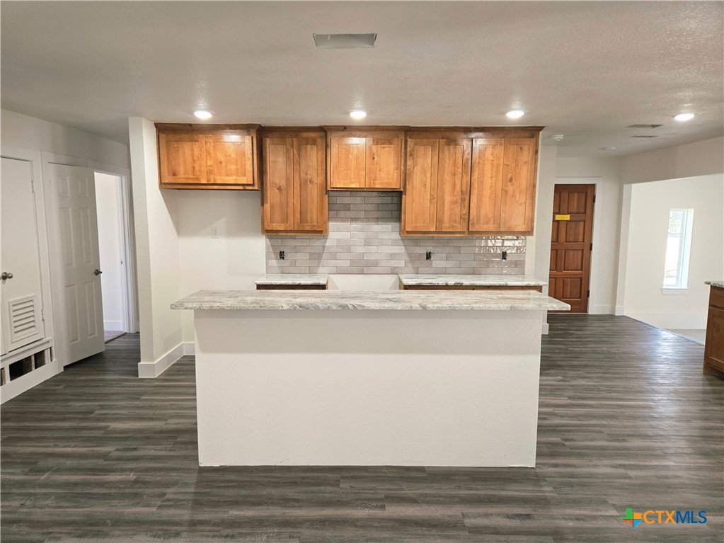 132 County Road 4765 Kempner, TX 76539 - Photo 13 of 29 a view of kitchen with granite countertop cabinets