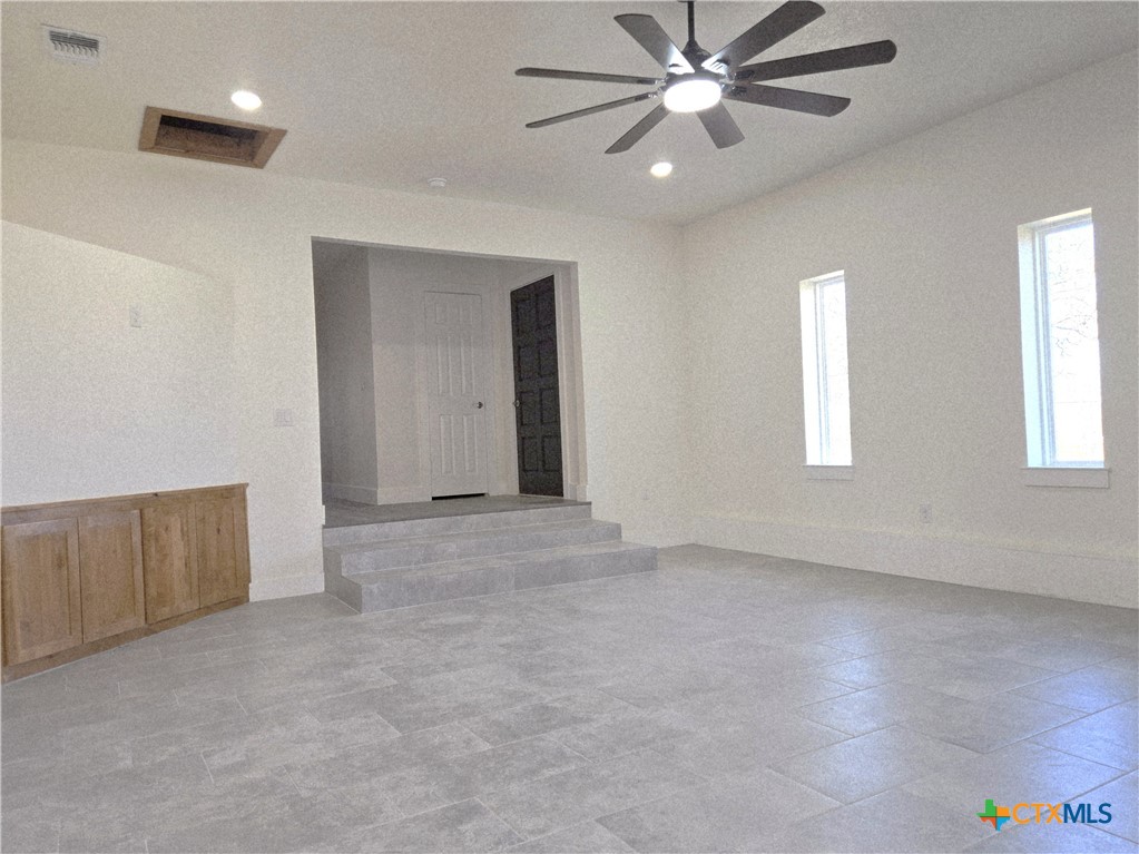 132 County Road 4765 Kempner, TX 76539 - Photo 13 of 36 an empty room with windows and fan