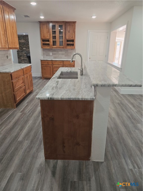132 County Road 4765 Kempner, TX 76539 - Photo 14 of 29 a living room with kitchen island granite countertop wooden floor and a sink