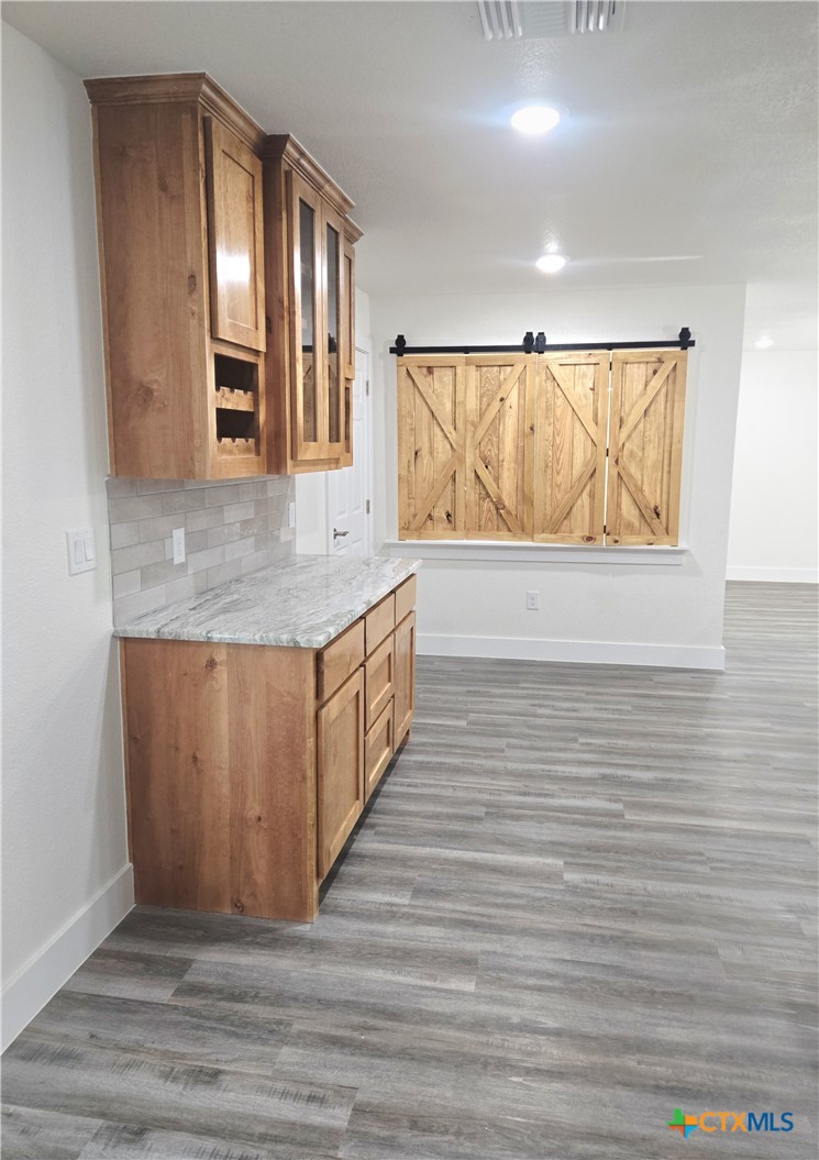 132 County Road 4765 Kempner, TX 76539 - Photo 14 of 36 a view hallway with wooden floor and cabinet