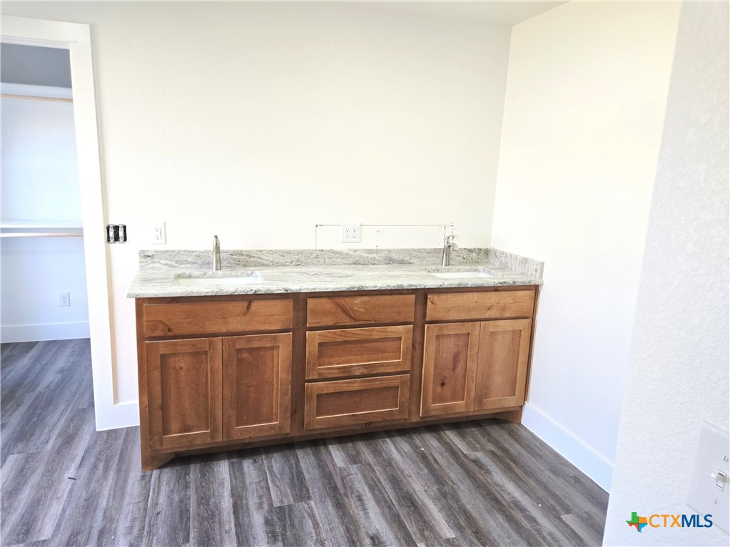 132 County Road 4765 Kempner, TX 76539 - Photo 23 of 29 a room with cabinets and wooden floor