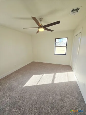 a view of hallway with windows