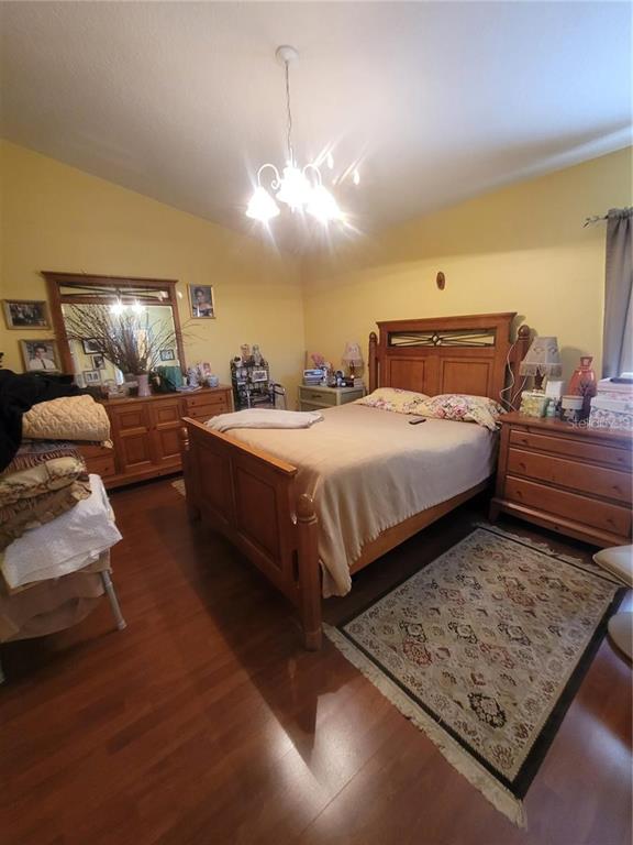 8430 Madrid Road Weeki Wachee, FL 34613 - Photo 6 of 11 a bedroom with a bed and window