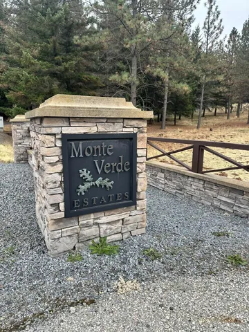 a view of a street with benches