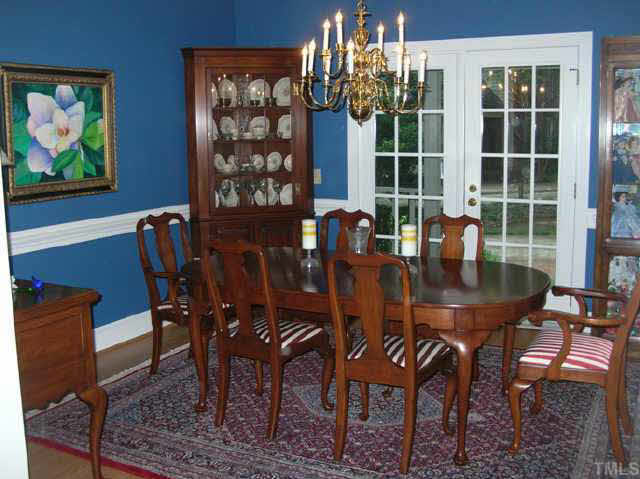 8821 Stage Ford Road Raleigh, NC 27615 - Photo 2 of 10 a view of a dining room with furniture window and outside view