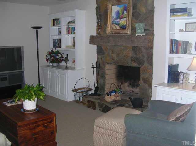 8821 Stage Ford Road Raleigh, NC 27615 - Photo 6 of 10 a living room with furniture and a potted plant