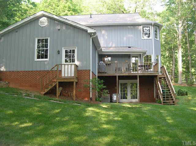 8821 Stage Ford Road Raleigh, NC 27615 - Photo 9 of 10 a front view of a house with a yard