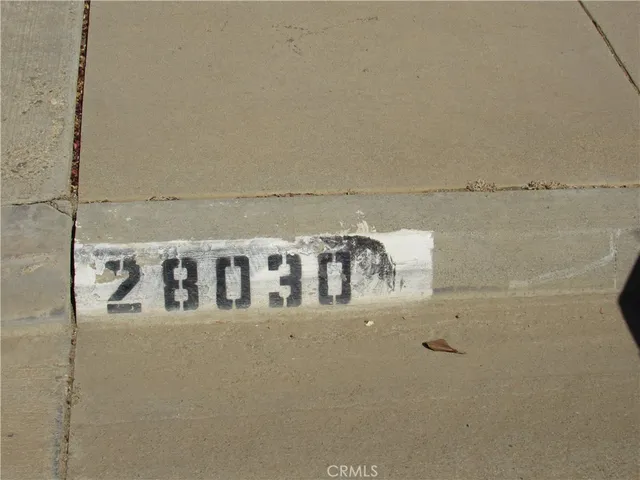 a view of living room filled with furniture and a table