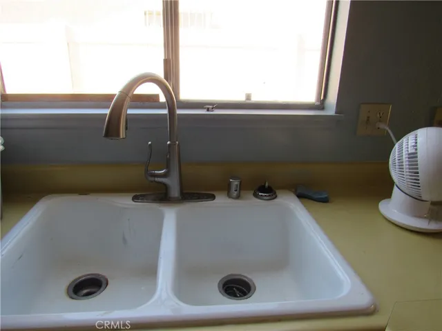 a bathroom with a sink and a window