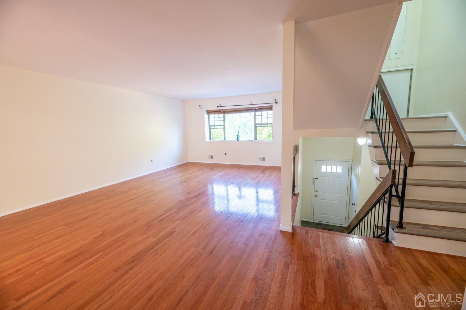 7101 Hana Road Edison, NJ 08817 - Photo 13 of 77 wooden floor in an empty room with a window