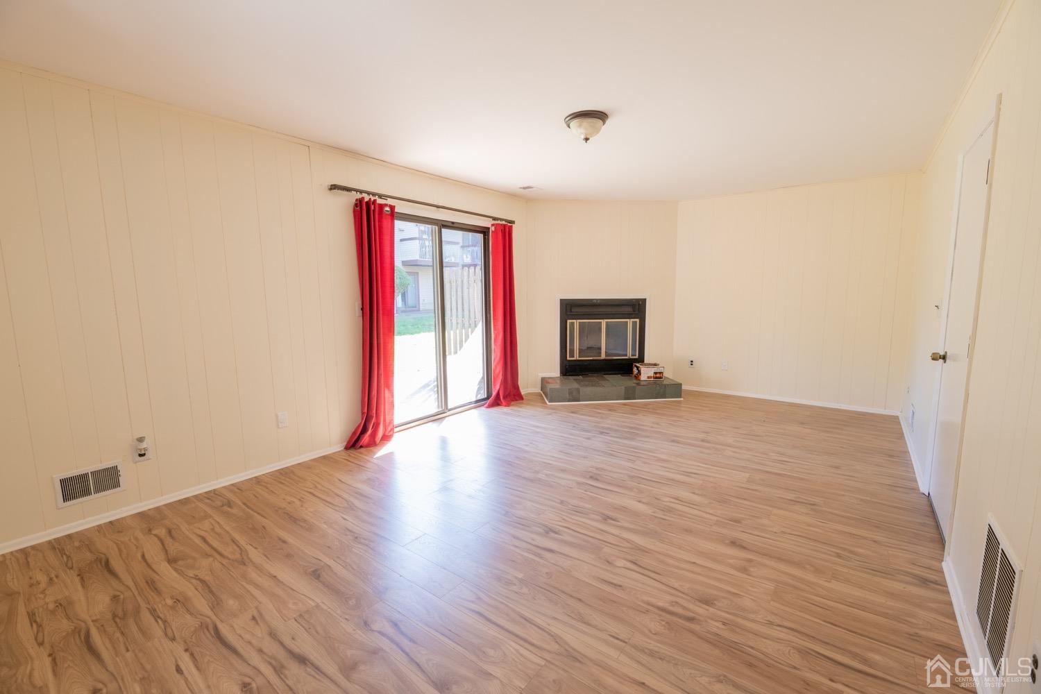 7101 Hana Road Edison, NJ 08817 - Photo 36 of 77 a view of empty room with wooden floor and fan