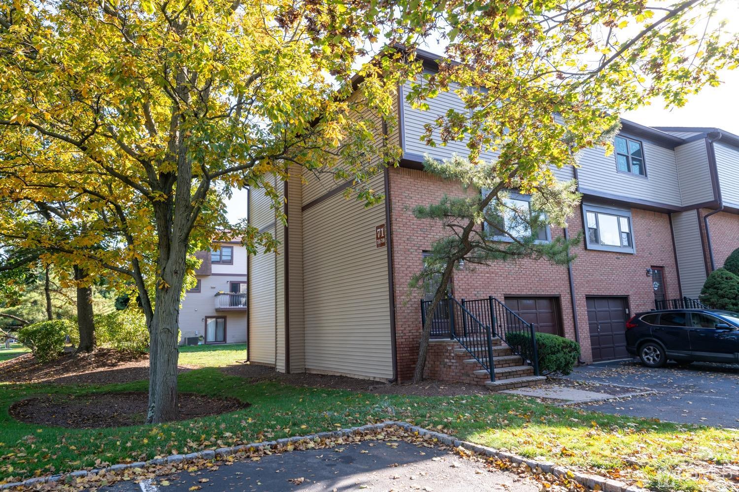 7101 Hana Road Edison, NJ 08817 - Photo 4 of 77 a view of a house with a tree in front of it