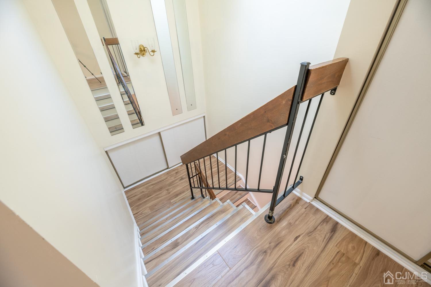 7101 Hana Road Edison, NJ 08817 - Photo 41 of 77 a view of staircase with white walls and a window