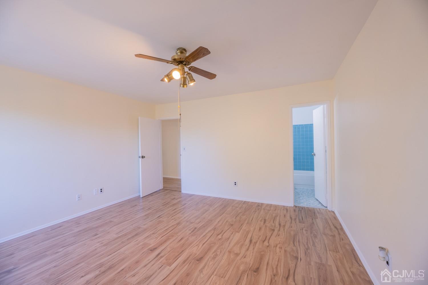 7101 Hana Road Edison, NJ 08817 - Photo 44 of 77 a view of empty room with wooden floor