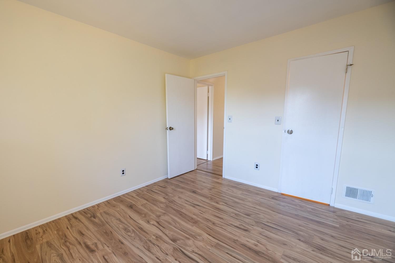7101 Hana Road Edison, NJ 08817 - Photo 53 of 77 a view of room with wooden floor