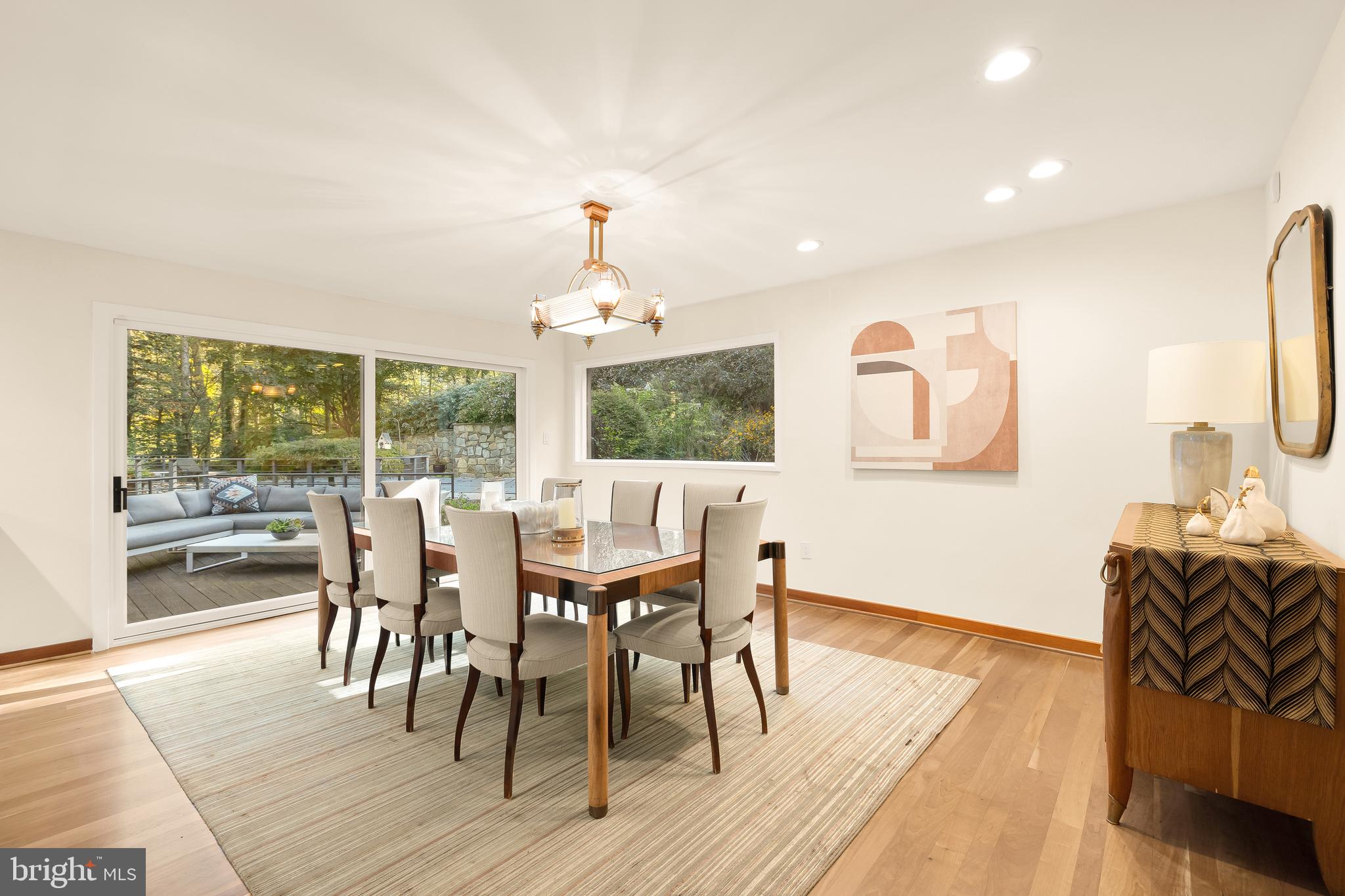 249 Springvale Road Great Falls, VA 22066 - Photo 13 of 49 a view of a dining room with furniture wooden floor and chandelier