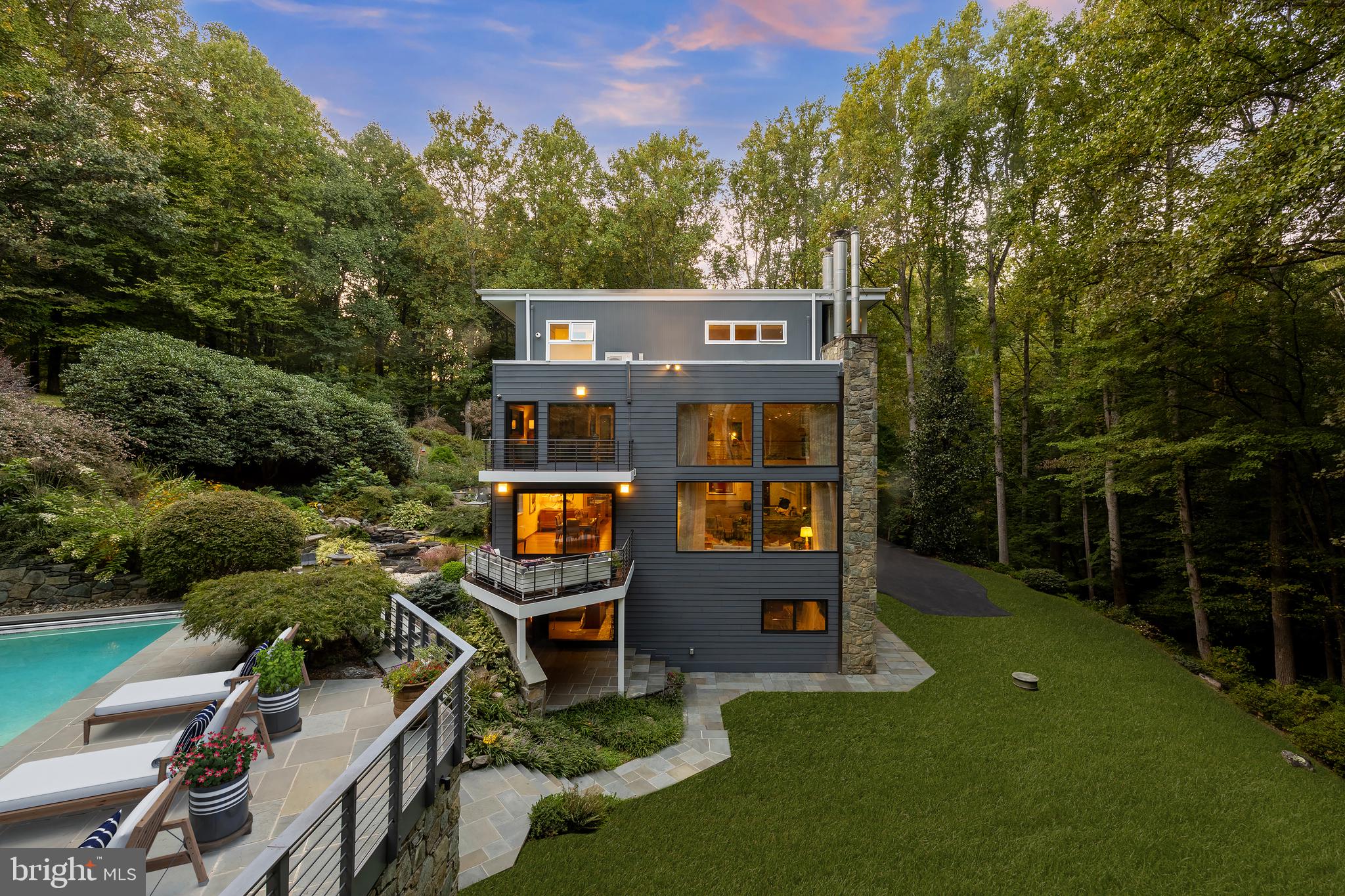 249 Springvale Road Great Falls, VA 22066 - Photo 2 of 49 a view of a chairs and table in the backyard