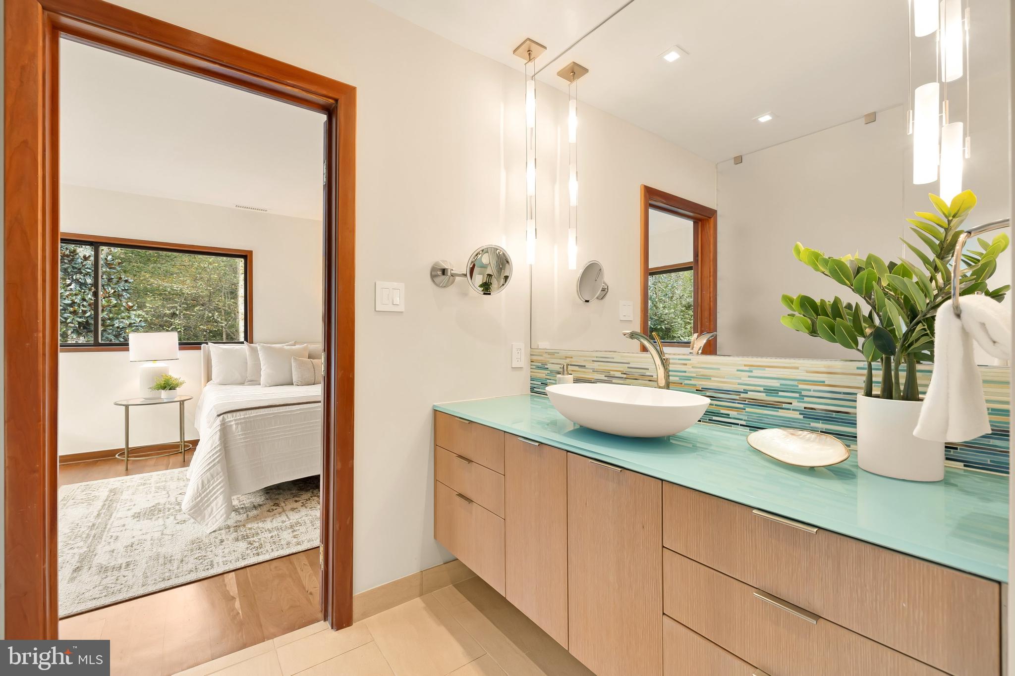 249 Springvale Road Great Falls, VA 22066 - Photo 23 of 49 a bathroom with a granite countertop sink and a mirror