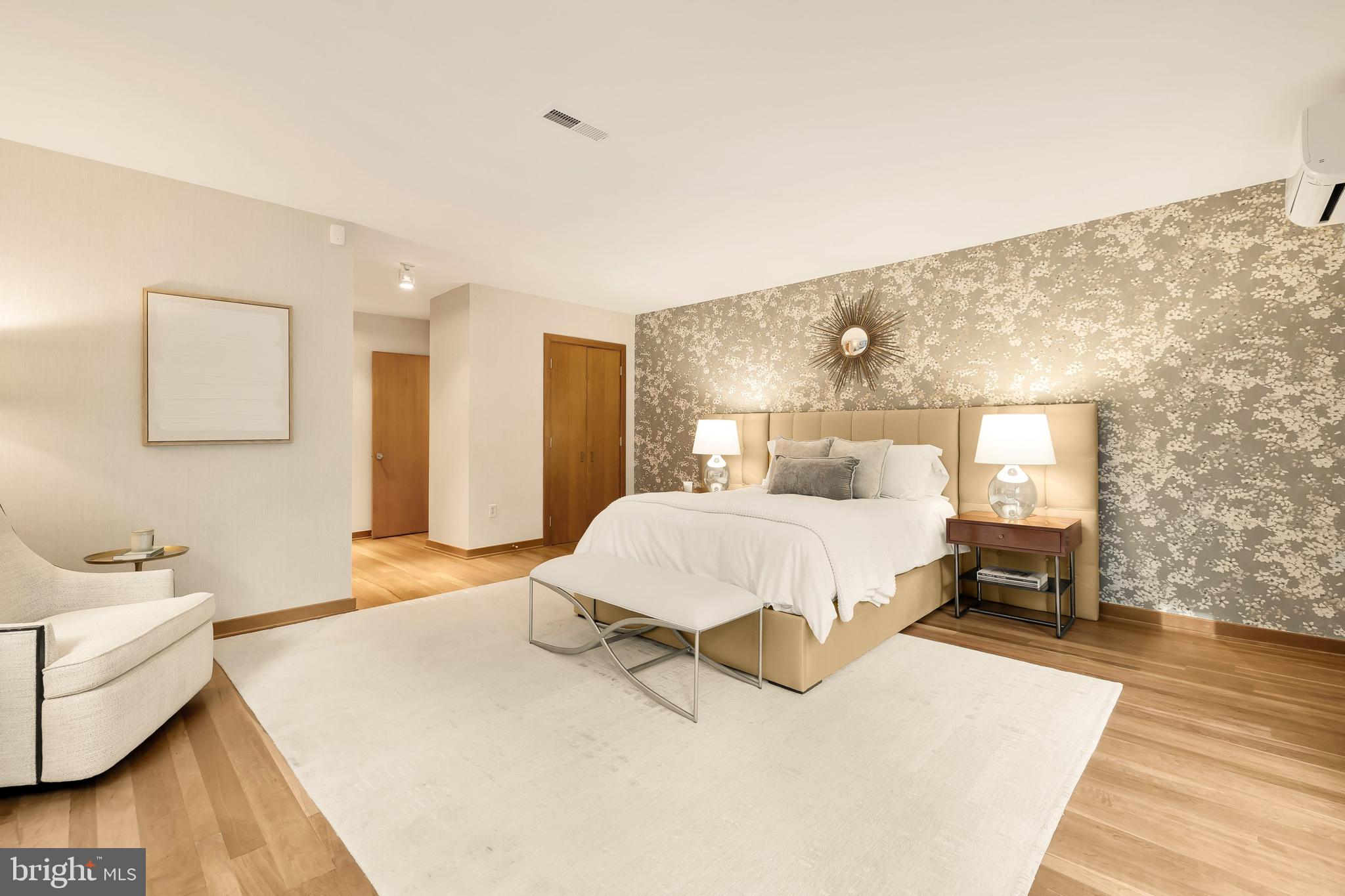 249 Springvale Road Great Falls, VA 22066 - Photo 26 of 49 a bedroom with a bed and wooden floor