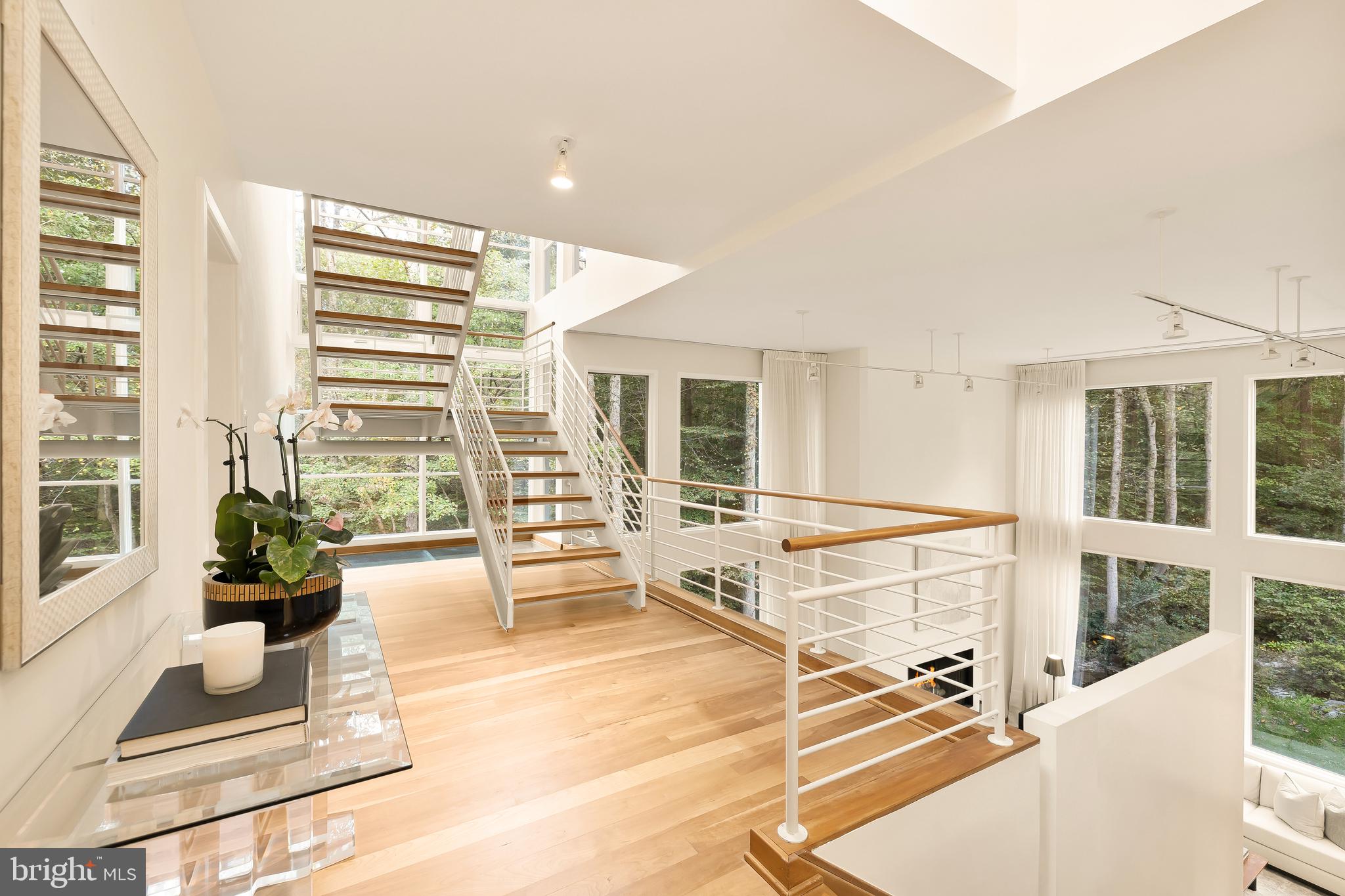 249 Springvale Road Great Falls, VA 22066 - Photo 29 of 49 a living room with a large window and furniture