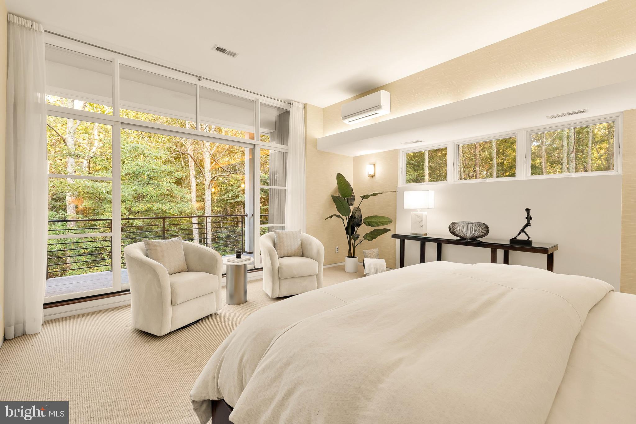 249 Springvale Road Great Falls, VA 22066 - Photo 30 of 49 a bedroom with two beds and a large window with outer view