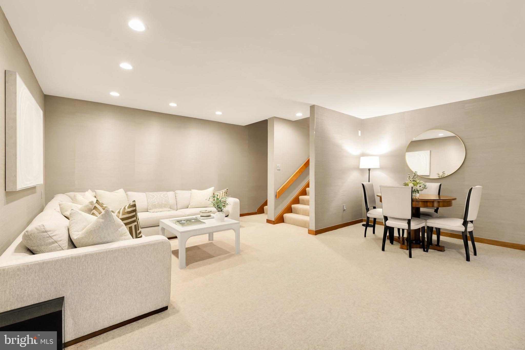 249 Springvale Road Great Falls, VA 22066 - Photo 38 of 49 a living room with furniture and a dining table with wooden floor