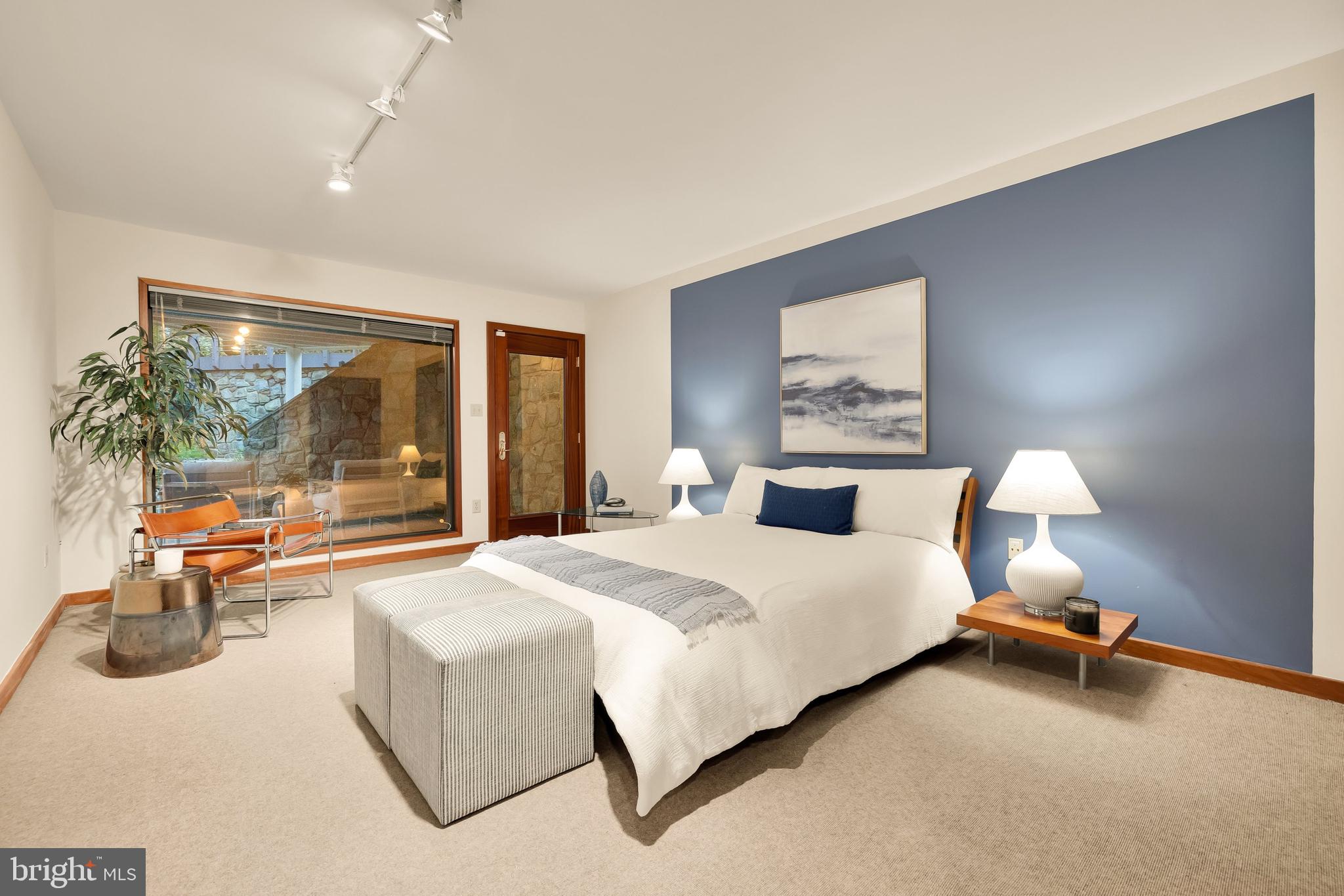 249 Springvale Road Great Falls, VA 22066 - Photo 39 of 49 a bedroom with a large bed and a large window