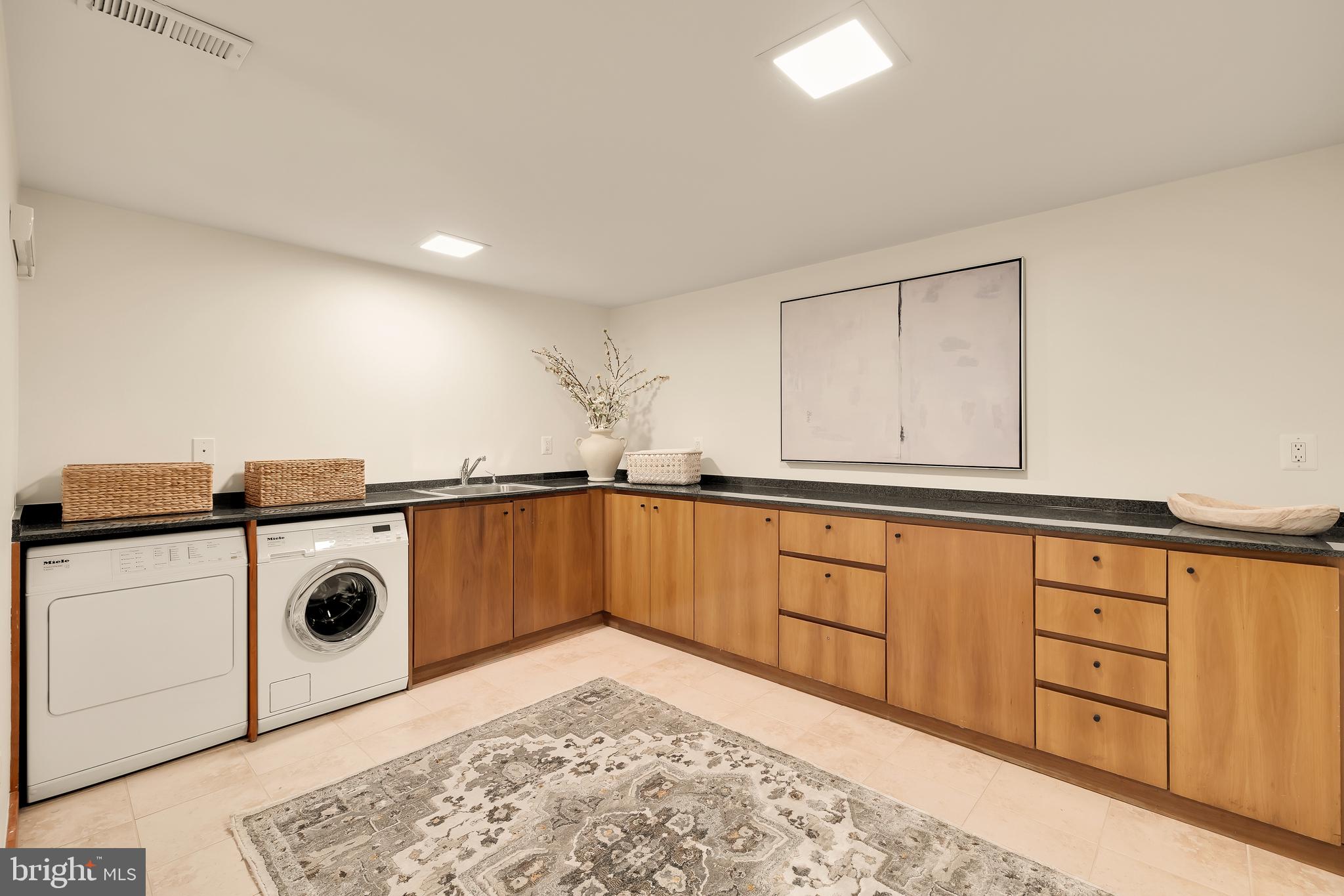 249 Springvale Road Great Falls, VA 22066 - Photo 43 of 49 a kitchen with stainless steel appliances granite countertop a sink and a stove top oven