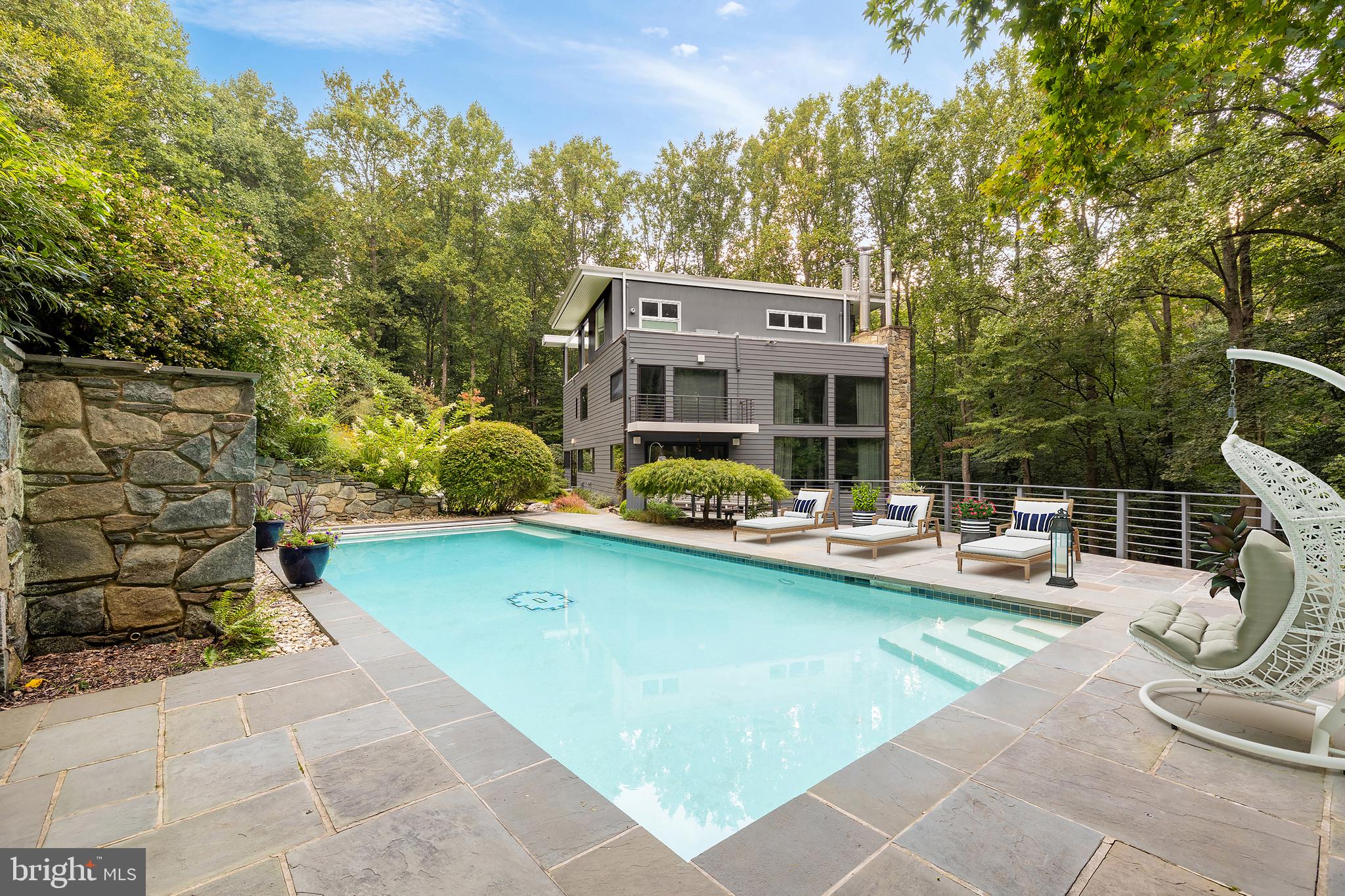 249 Springvale Road Great Falls, VA 22066 - Photo 45 of 49 a view of a house with swimming pool and sitting area