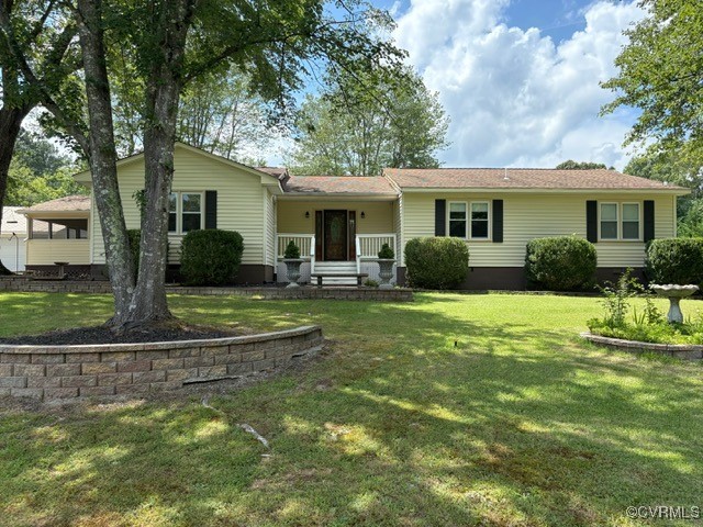 Ranch-style home with a front lawn