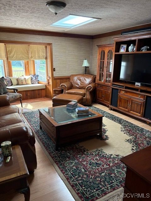 127 Wickham Road Bumpass, VA 23024 - Photo 8 of 10 Living area featuring wainscoting and light wood f