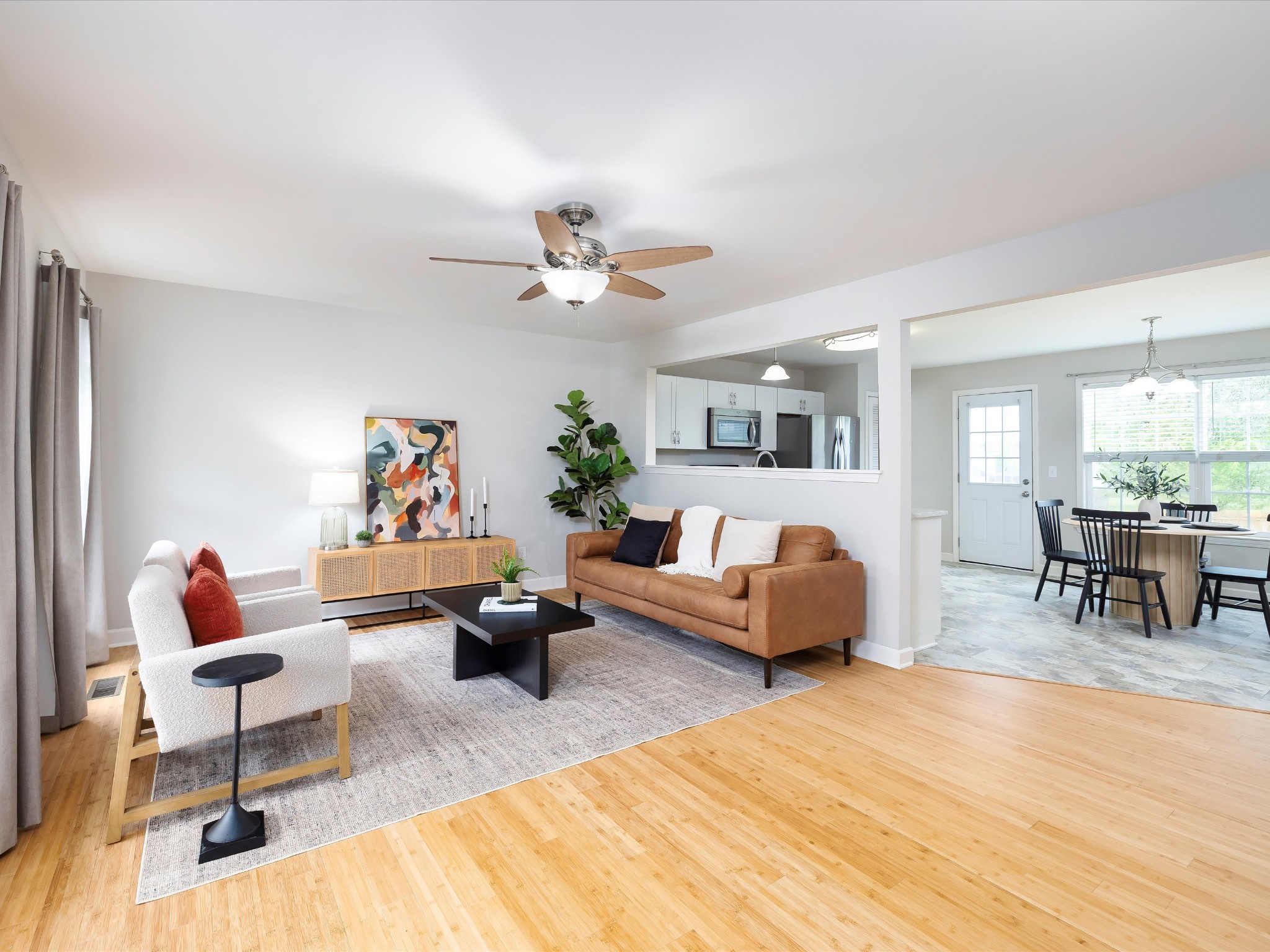 1007 Persimmon Drive Spring Hill, TN 37174 - Photo 12 of 44 a living room with furniture and a dining table with wooden floor