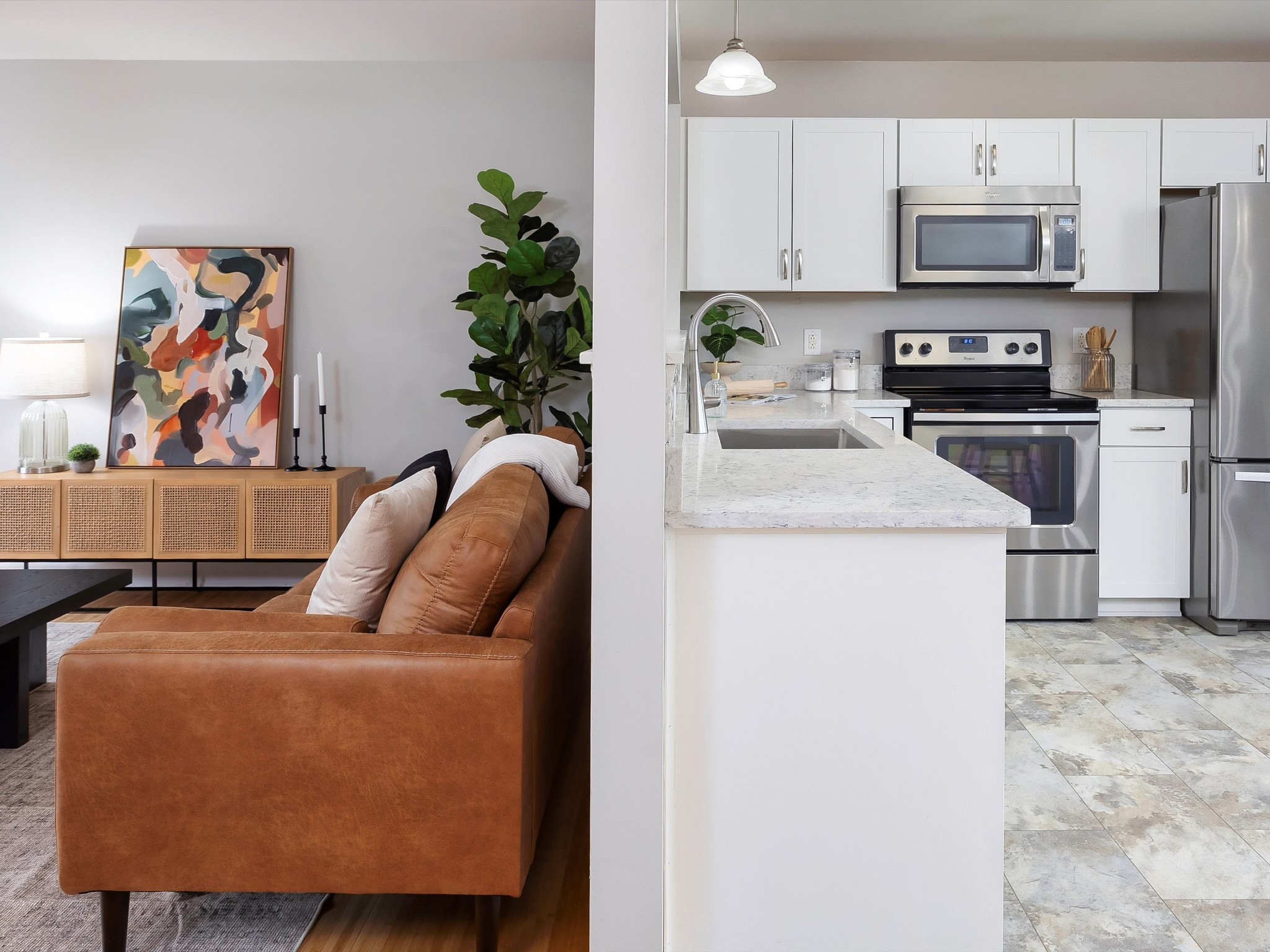 1007 Persimmon Drive Spring Hill, TN 37174 - Photo 13 of 44 a kitchen with stainless steel appliances granite countertop a refrigerator a stove a sink and a microwave
