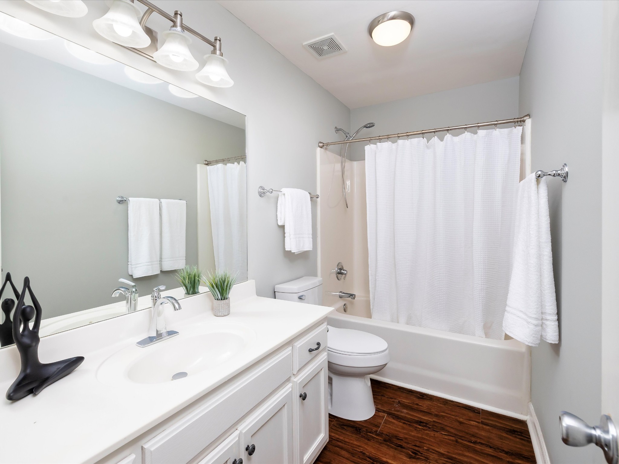 1007 Persimmon Drive Spring Hill, TN 37174 - Photo 20 of 44 a bathroom with a double vanity sink toilet mirror and shower